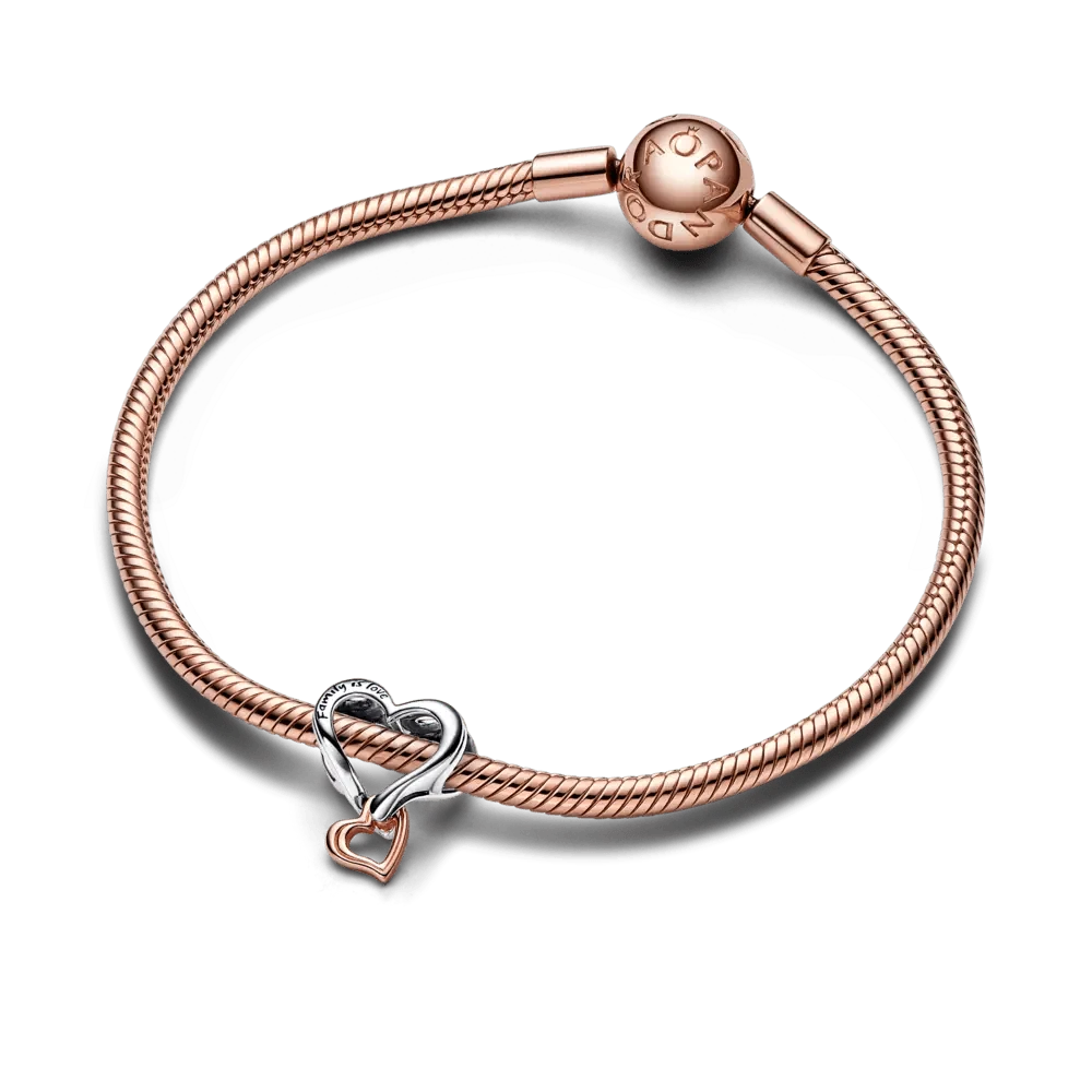 Divtoņu ažūra rakstā veidots bezgalības sirds amulets