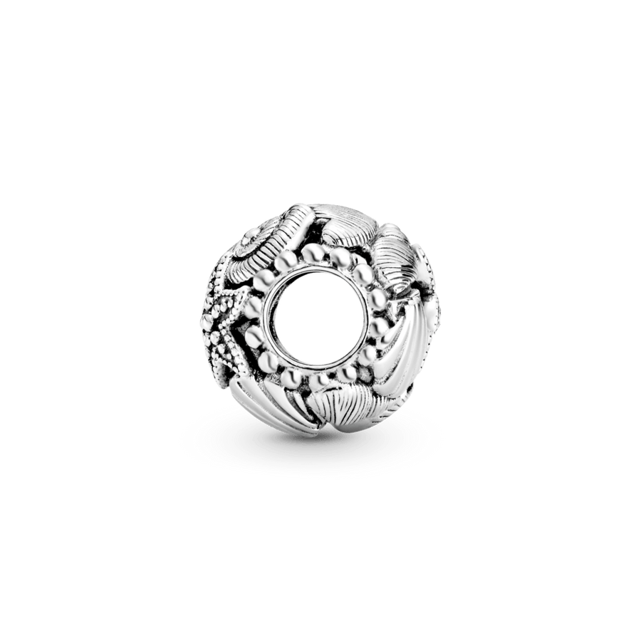 Ažūra rakstā veidots jūraszvaigznes, gliemežvāku un sirsniņu amulets