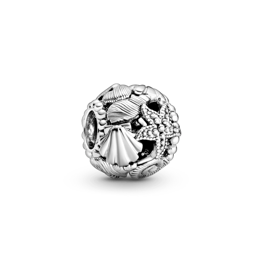Ažūra rakstā veidots jūraszvaigznes, gliemežvāku un sirsniņu amulets