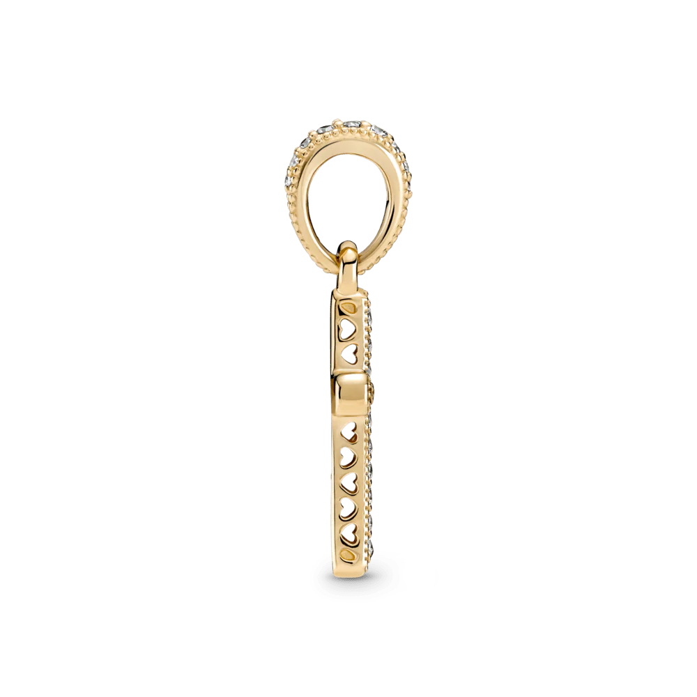 Mirdzošais krusta kulons