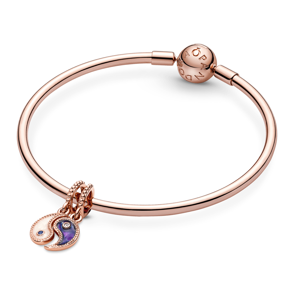 Piekarināmais amulets ar mirdzošu un sadalāmu jiņ un jaņ amuletu