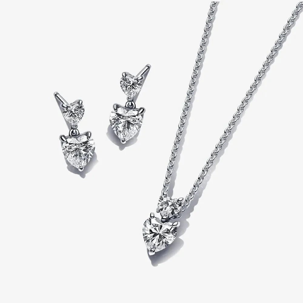 Dāvanu komplekts: Mirdzošā, pieguļošā kaklarota ar divu sirsniņu kulonu & Mirdzošie dubultsirsniņas nagliņauskari