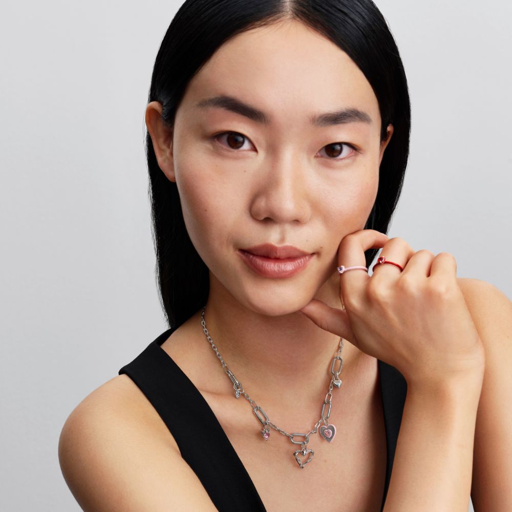 Starojošs rozā sirds medaljona amulets