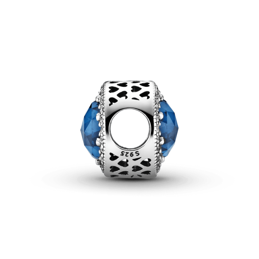 Mirdzošais tumši zilais amulets