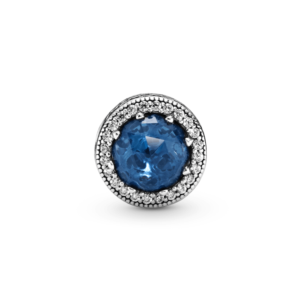 Mirdzošais tumši zilais amulets