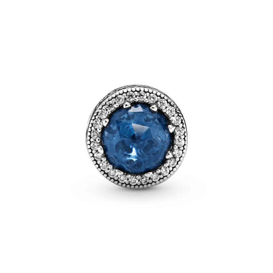 Mirdzošais tumši zilais amulets