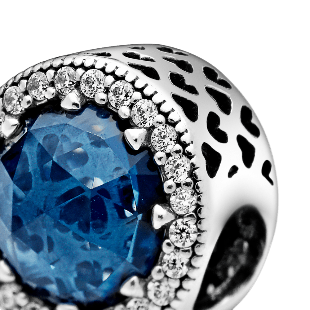 Mirdzošais tumši zilais amulets