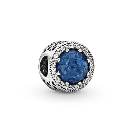 Mirdzošais tumši zilais amulets