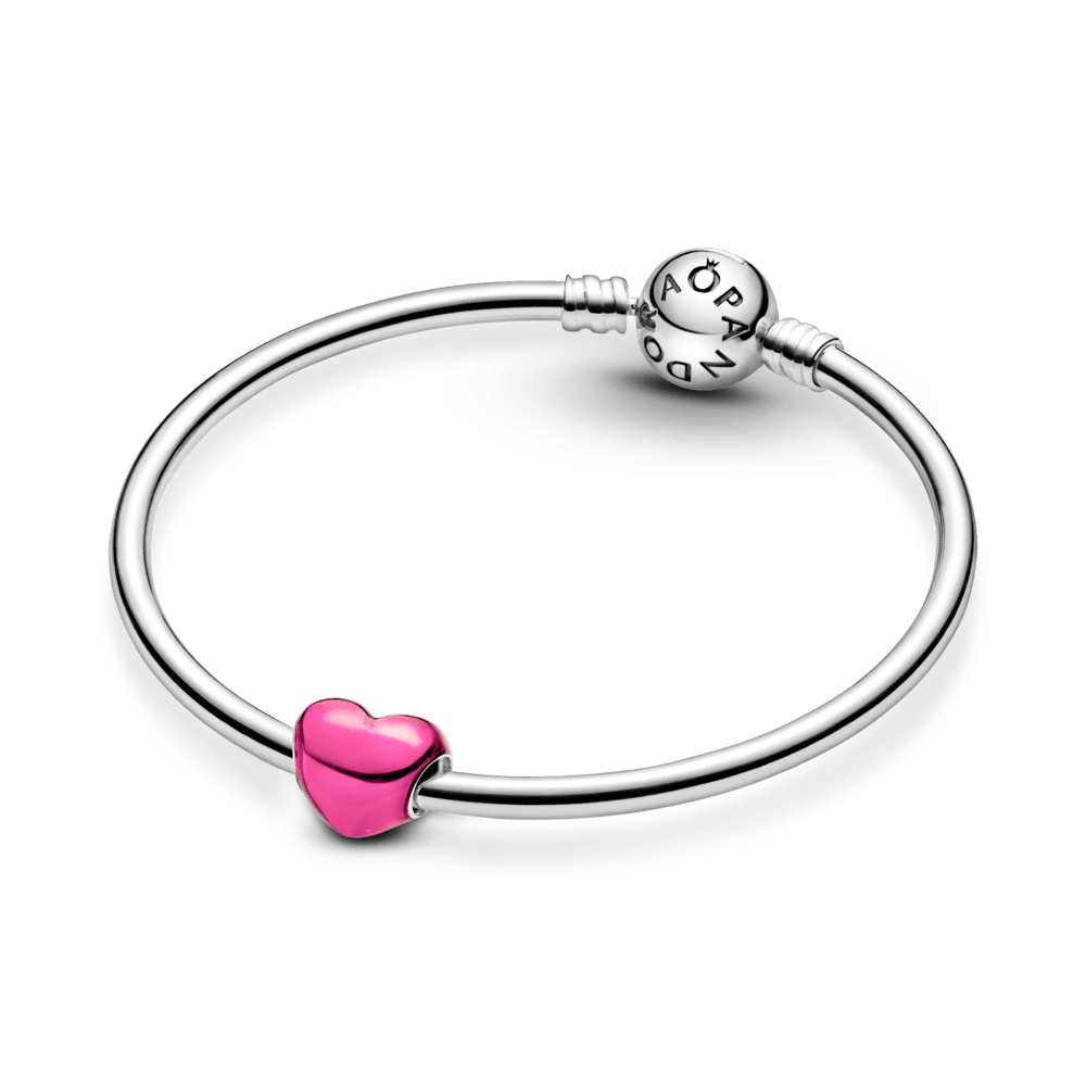 Metāliski rozā sirds formas amulets