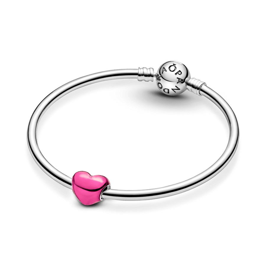 Metāliski rozā sirds formas amulets