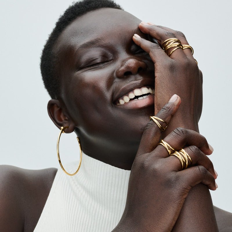 Organiskas formas trīskāršas joslas atvērtais gredzens