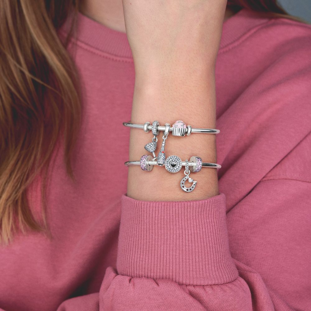 Dzirkstošā vīna pudeles amulets