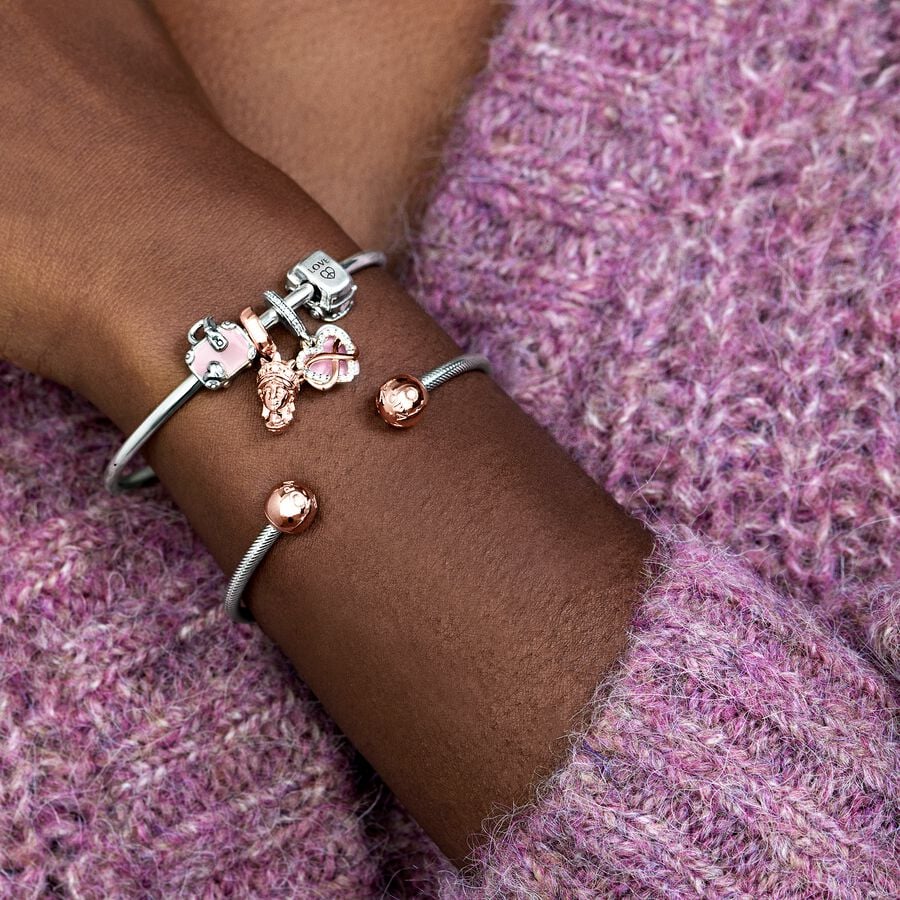 Rozā ceļojuma somas amulets