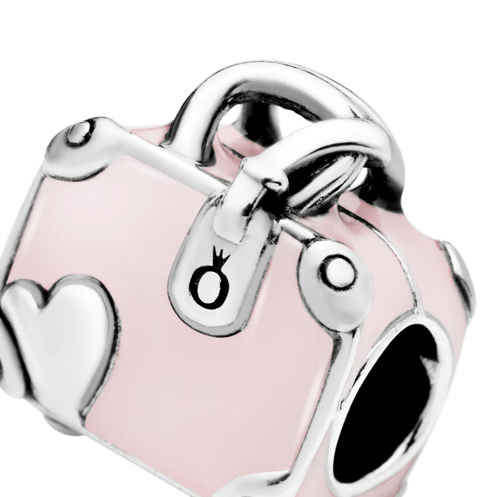 Rozā ceļojuma somas amulets