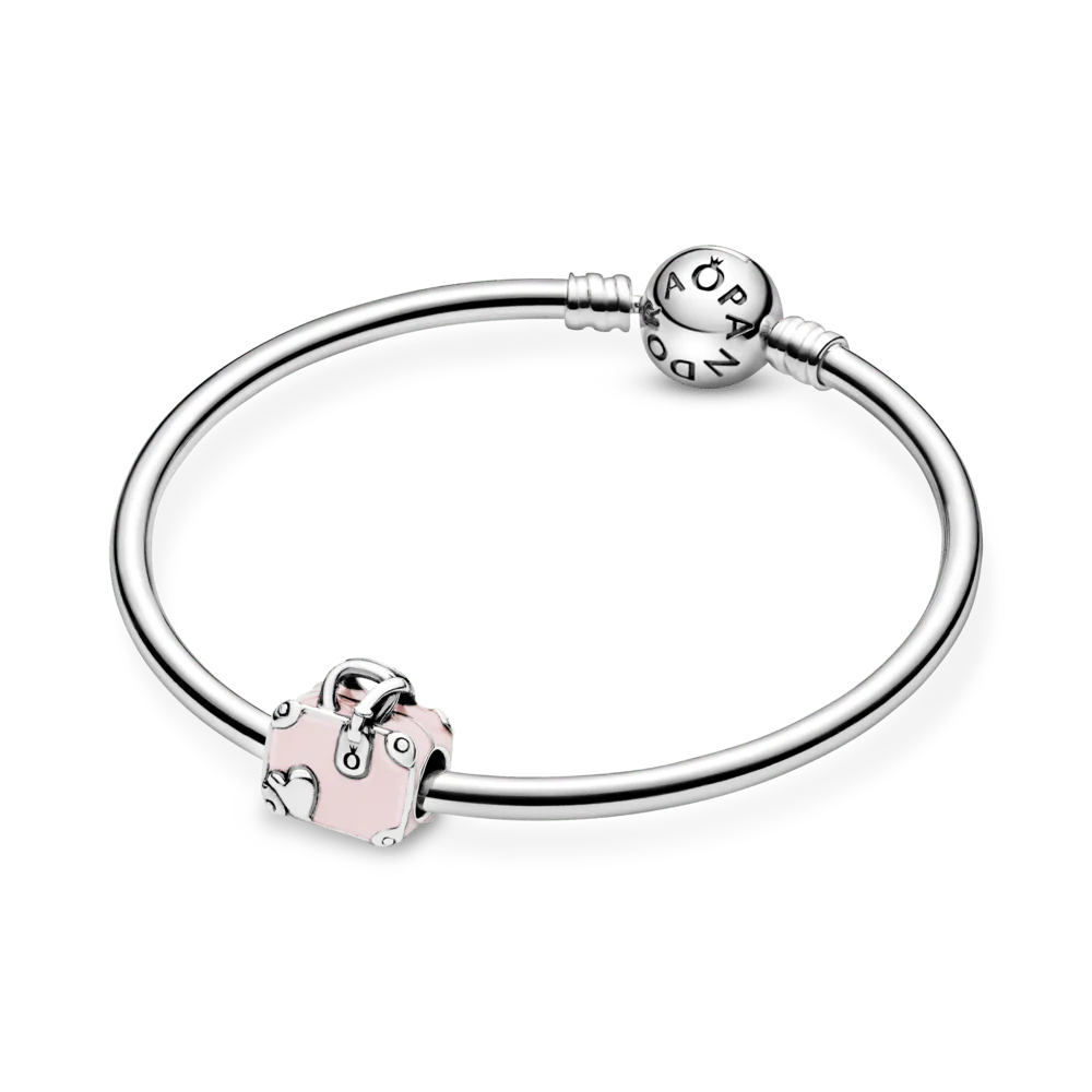 Rozā ceļojuma somas amulets