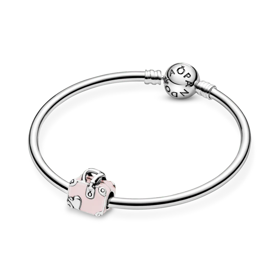 Rozā ceļojuma somas amulets