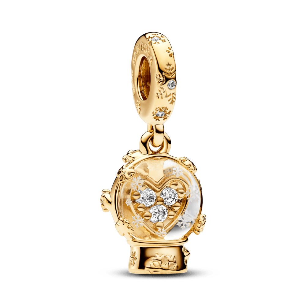 Sirds sniegpārsliņas un sniega globusa piekariņš