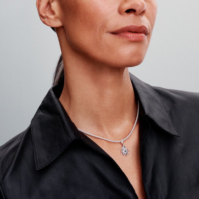 Mirdzošs dubultais uguņošanas amulets