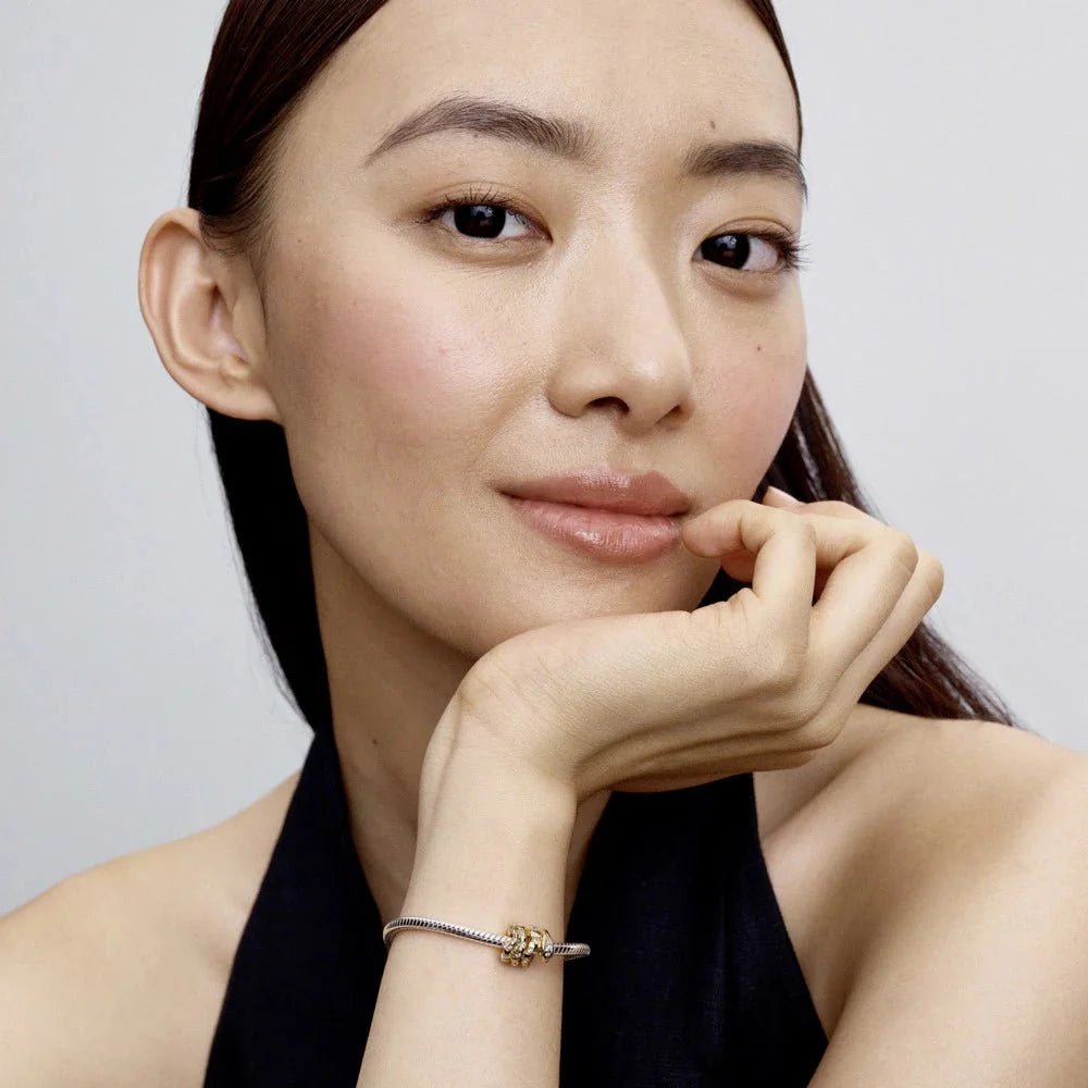 Saritinātas čūskas amulets