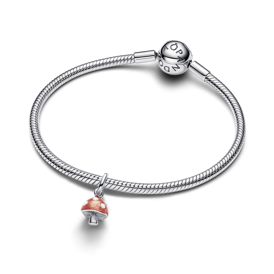 Tumsā spīdošs sēnes formas amulets