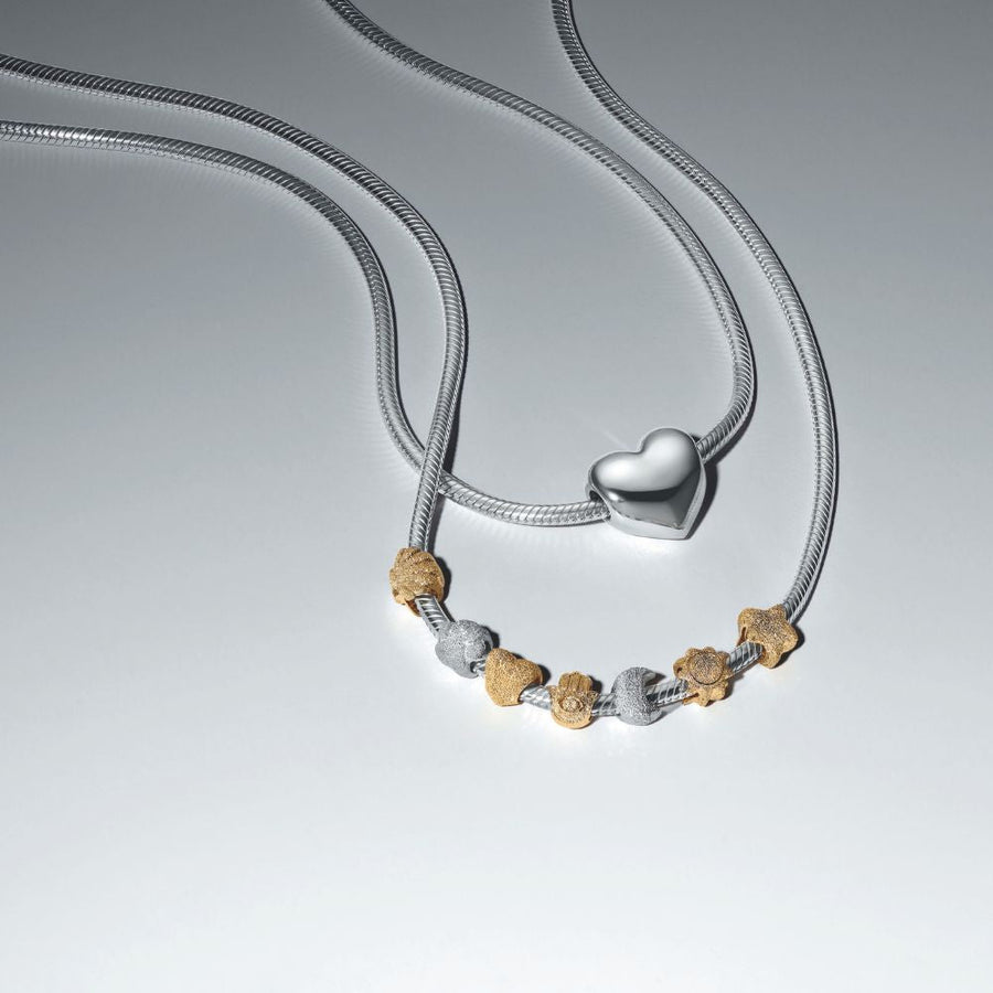 Teksturētais gliemežvāka mini amulets