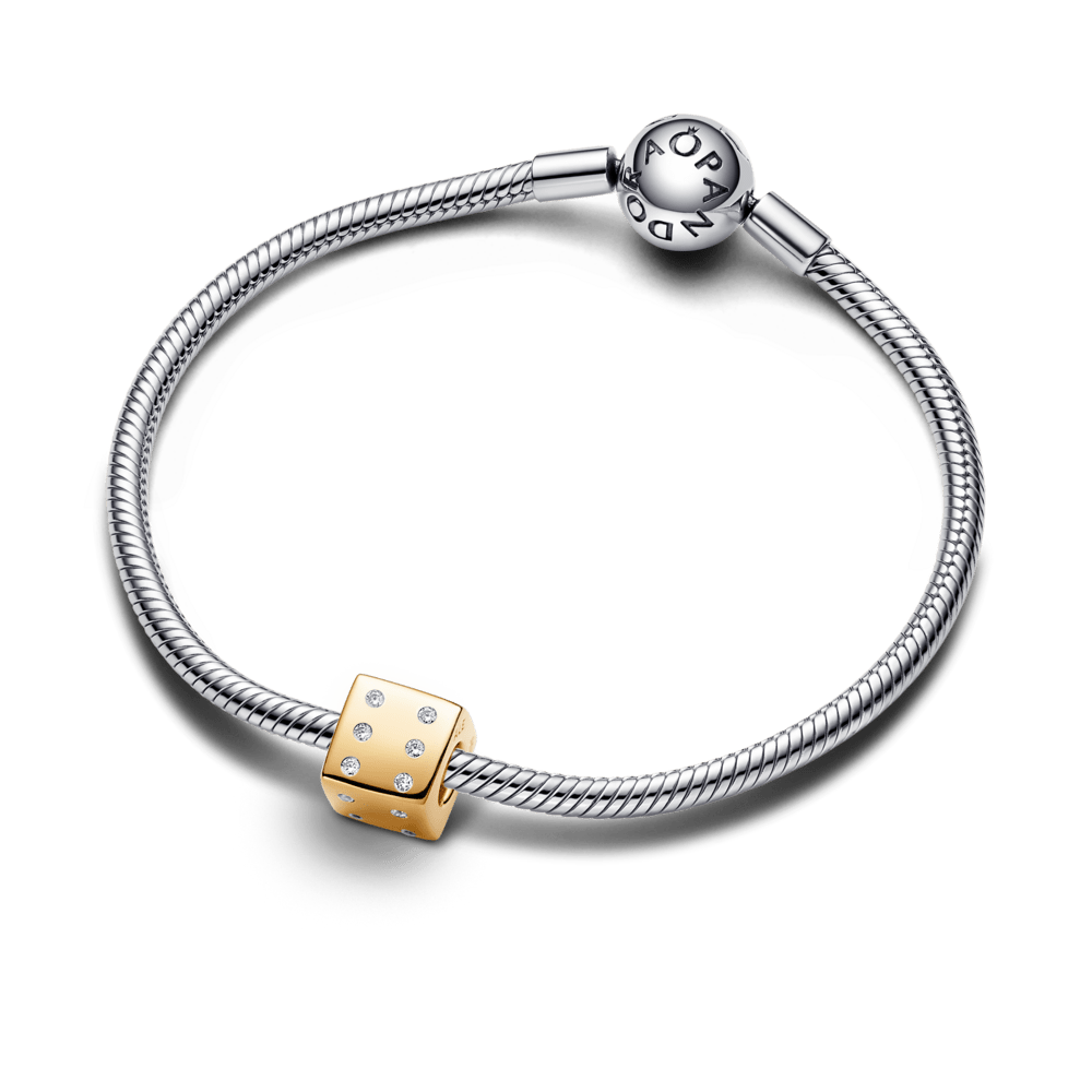 Mirdzošs kauliņu amulets